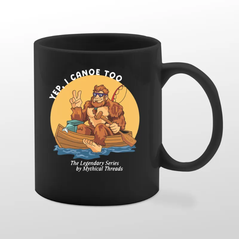 Black mug with Bigfoot canoeing graphic