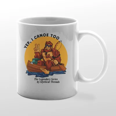 White mug with Bigfoot canoeing graphic