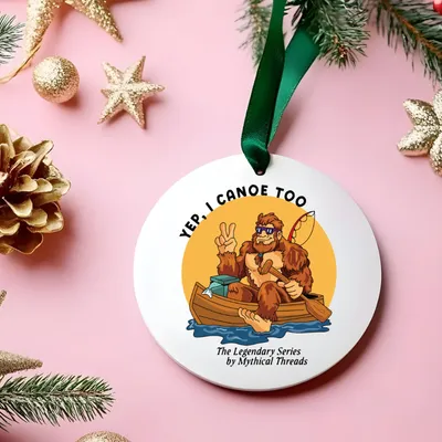 White mug with Bigfoot canoeing graphic