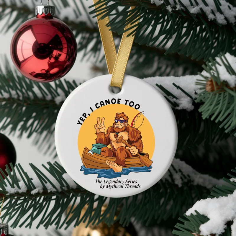 White mug with Bigfoot canoeing graphic