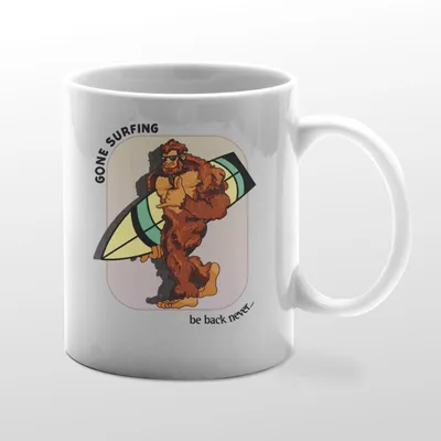 White mug with Bigfoot surfboarding graphic