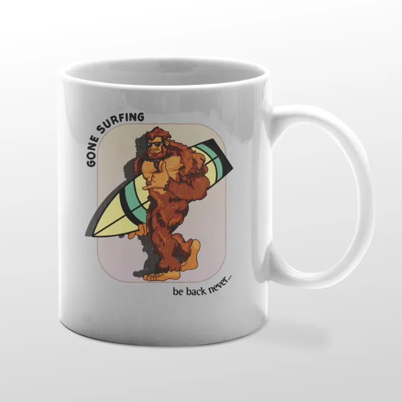 White mug with Bigfoot surfboarding graphic