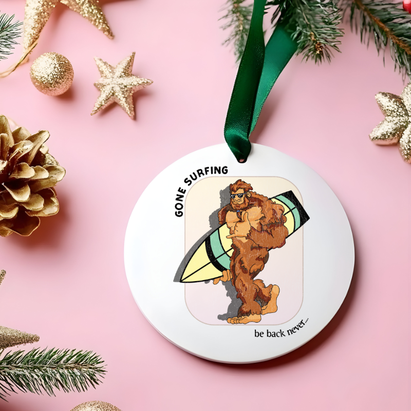 White mug with Bigfoot walking with his surfboard graphic