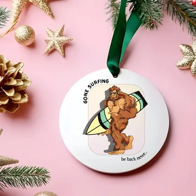 White mug with Bigfoot walking with his surfboard graphic