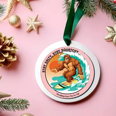 White mug with Bigfoot surfing graphic