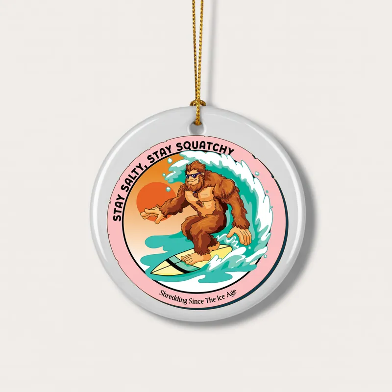 White mug with Bigfoot surfing graphic