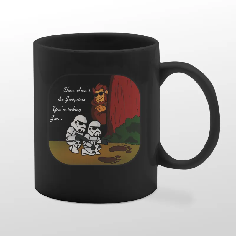Black mug with Bigfoot birdwatching graphic